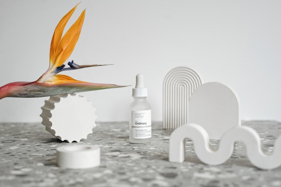 Professional eyelash technician working on client in modern lash studio